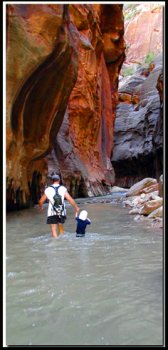 Kids in Zion: Father and son enjoy hiking in the Zion Narrows