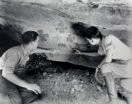 people looking at cave art